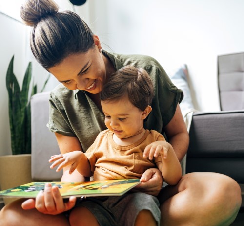 Mother and child reading a book together